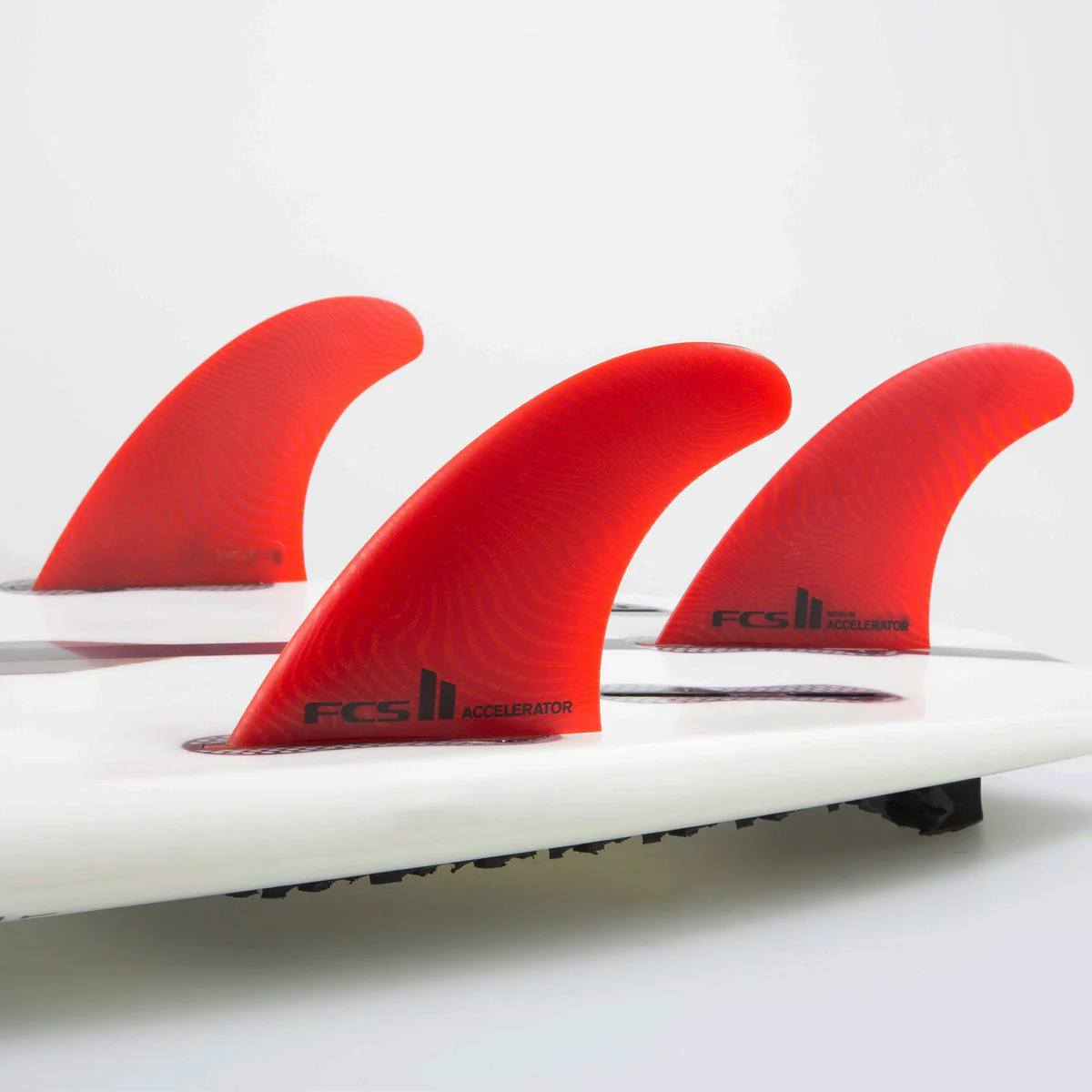FCS II Medium Accelerator Neo Glass Eco Blend Thruster Surfboard Fins - Red - Image 2